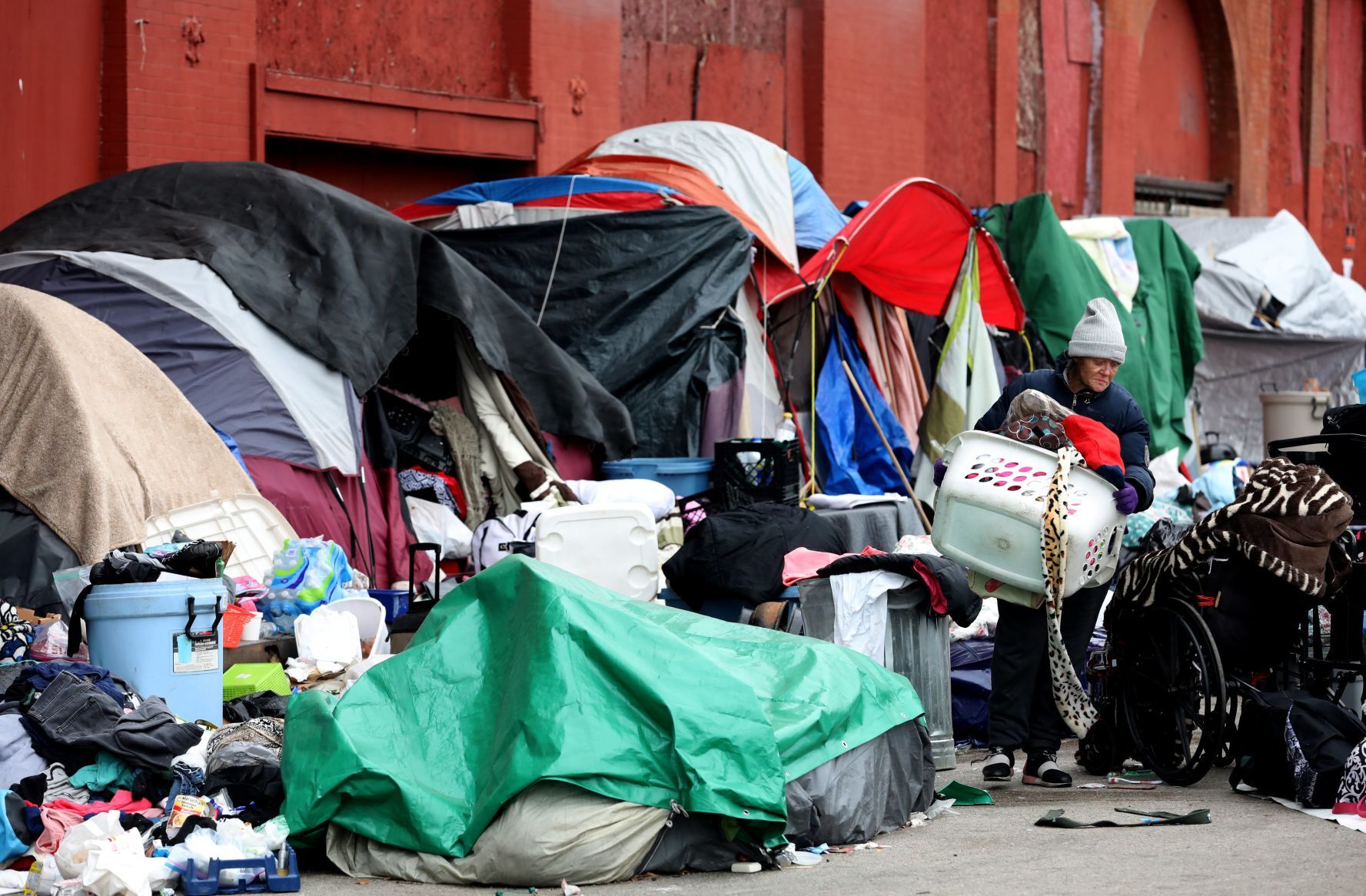 Tent encampment outside vacant McGuire Moving & Storage building